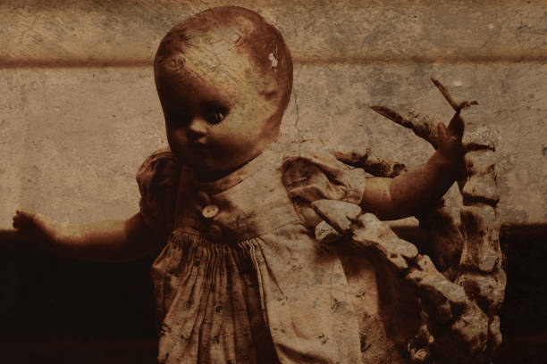 Haunted Doll being grabbed by skeletal hand
