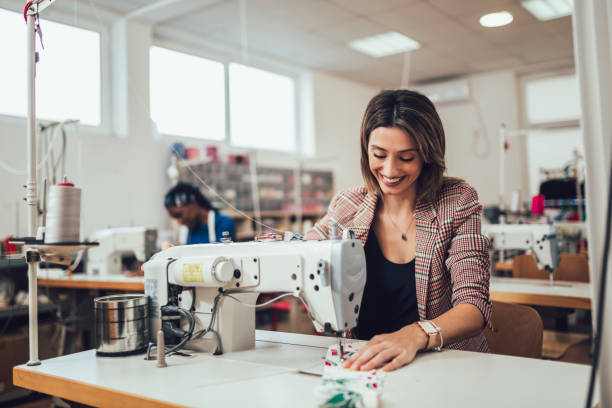 istock Dressmaker woman working with sewing machine 1225623659