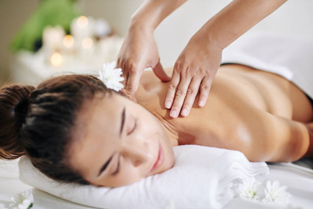 istock Young woman enjoying massage 1225624664