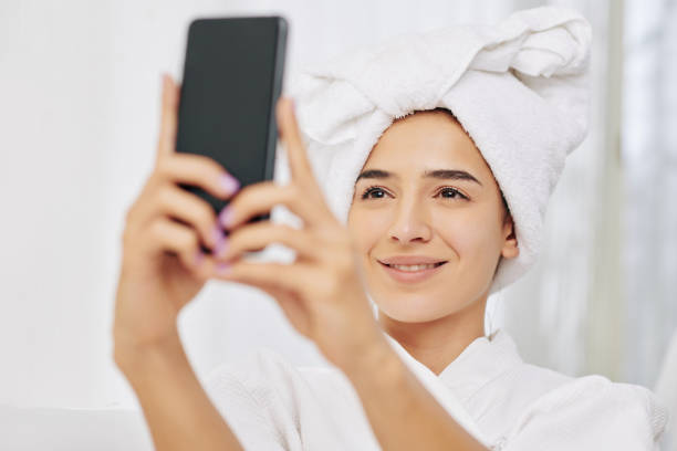 istock Woman photographing in bathrobe 1225624706