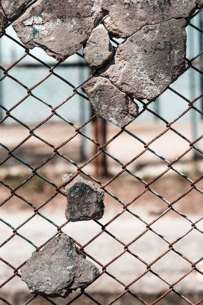 istock Pieces of broken concrete on a metal mesh 1225625928