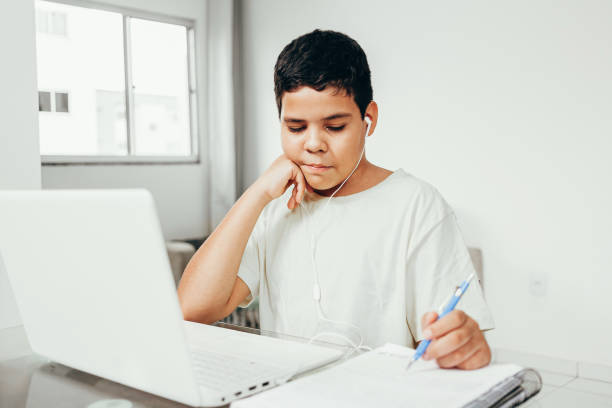 istock Distance learning online education. A boy studies at home and does school homework. A home distance learning. 1225626241