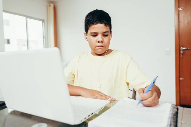 istock Distance learning online education. A boy studies at home and does school homework. A home distance learning. 1225626245