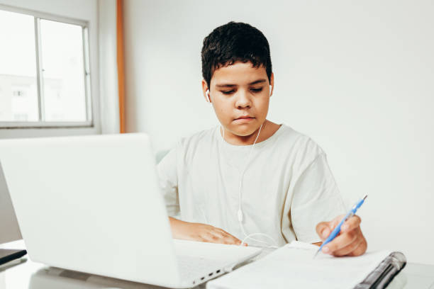istock Distance learning online education. A boy studies at home and does school homework. A home distance learning. 1225626247