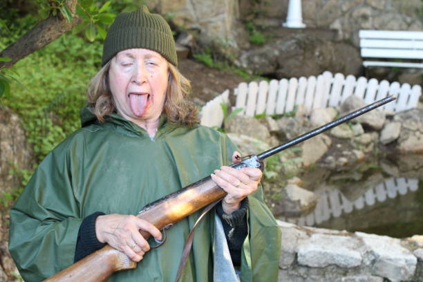 Anxious female hunter sticking tongue out.