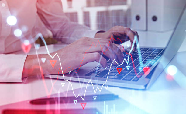 istock Woman hands with laptop in office, falling graph 1225626425