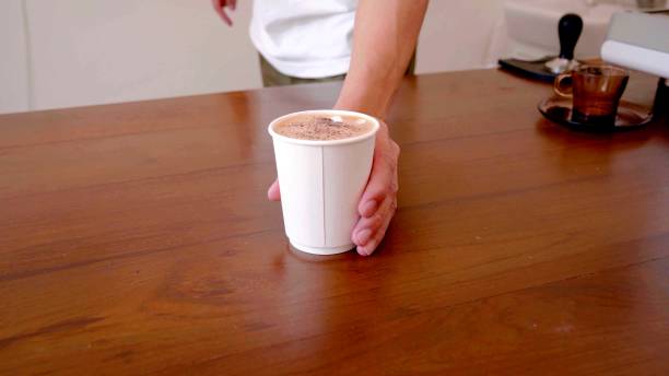 istock man who is taking a cup of coffee on a table 1225627369