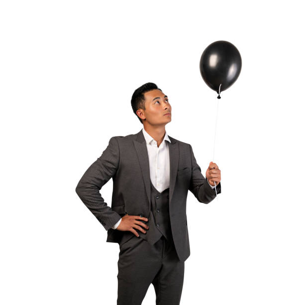 istock Asian businessman holding balloon, isolated 1225627372