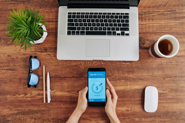 istock Woman paying with banking app 1225627691