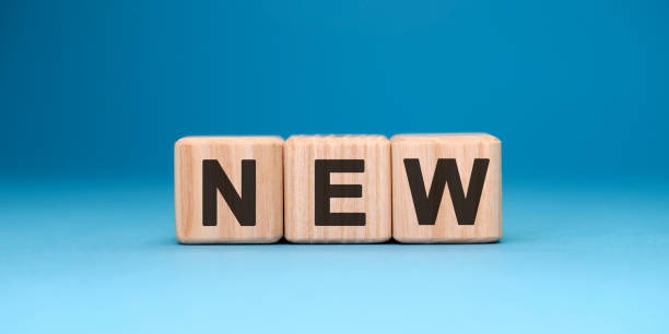 istock NEW word cube on a blue background. Business concept. 1225628441