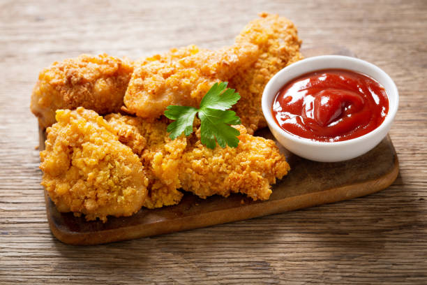 istock fried chicken on a wooden board 1225629081