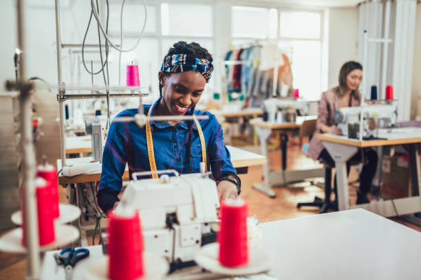 istock Dressmaker woman working with sewing machine 1225629987