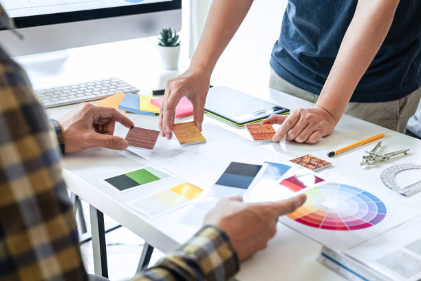 istock Team design of young Interior graphic designer working house project sketching on graphic tablet and color swatch working at modern office, creative inspiration and imagine 1225631946