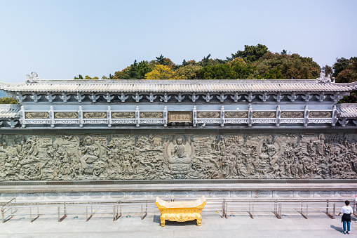 Building of Chinese buddhist temple in Mount Luojia, which lies in the Lotus Sea to the southeast of Putuo Mountain, Zhoushan, Zhejiang, the place where Bodhisattva Guanyin practiced Buddhism