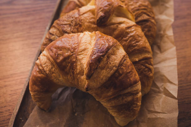 istock delicious croissants on craft paper 1225632883