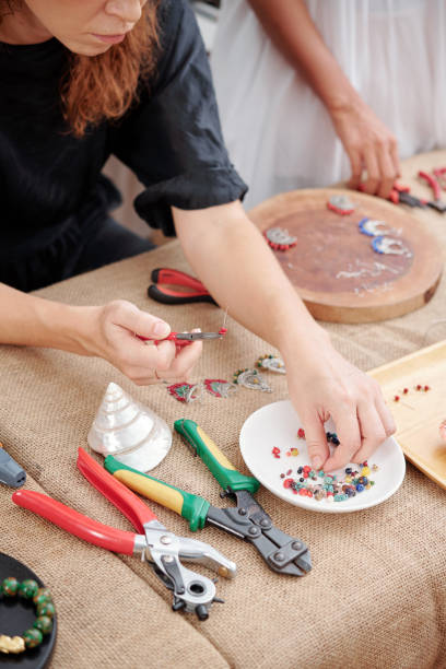 istock Woman making jewelry 1225633362