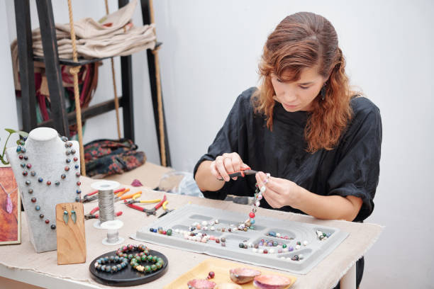 istock Woman concentrated on making jewelry 1225633394