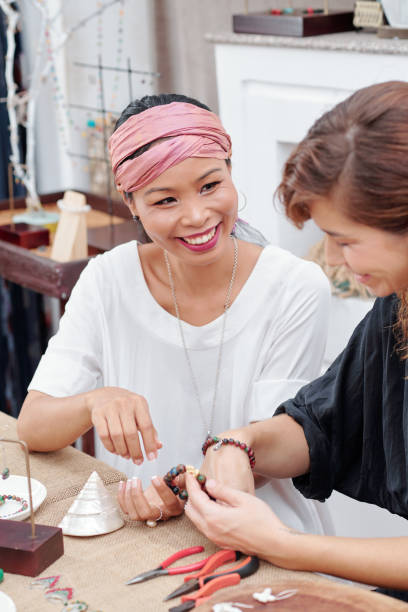 istock Friends making jewelry 1225633457