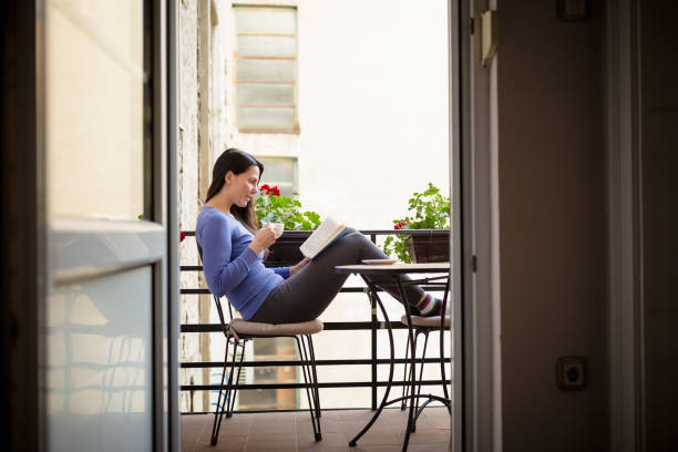 istock Woman reading book an enjoying 1225637289