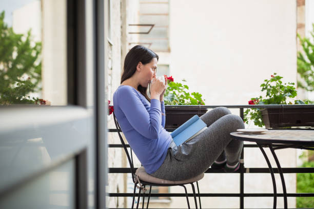 istock Woman reading book an enjoying 1225637390