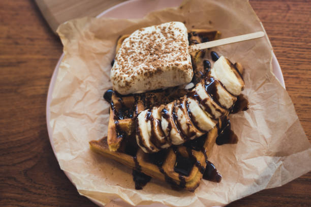 istock brussels waffles with ice cream and banana 1225638383