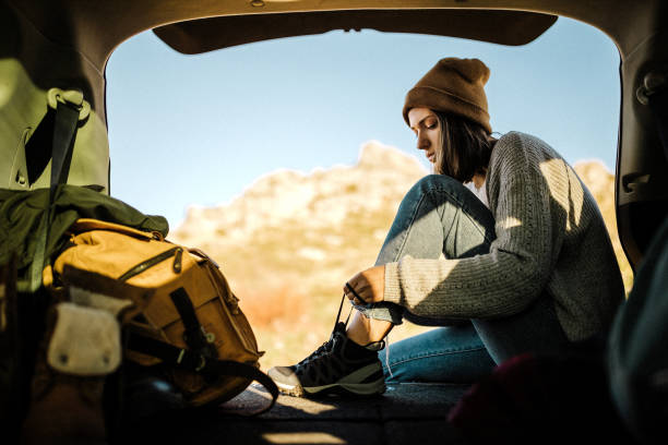 istock Young female hiker getting ready for adventure 1225638625