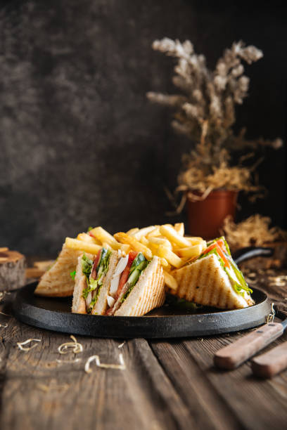 istock Sandwiches with fries on the black pan 1225638724