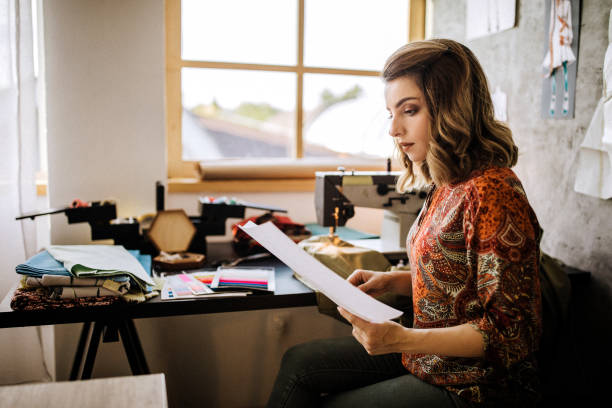 istock Female tailor sketching in clothing design studio 1225642449