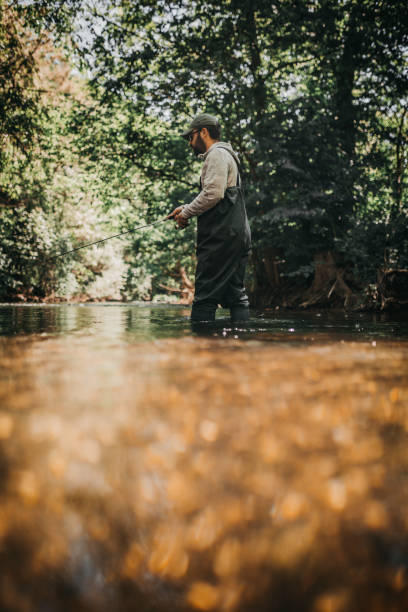 istock Young man fishing 1225649672