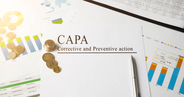 istock Paper with Corrective and Preventive CAPA action plans on a table 1225651590