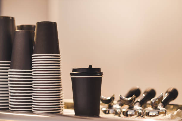 istock Black cups for coffee and horns for the coffee machine 1225652512