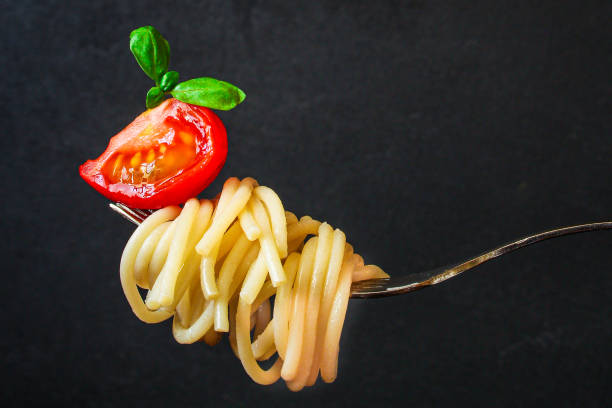 istock pasta spaghetti with tomato and basil, Menu concept healthy eating. food background top view copy space 1225653627