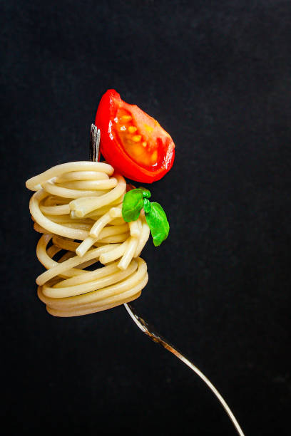 istock pasta spaghetti with tomato and basil, Menu concept healthy eating. food background top view copy space 1225653628