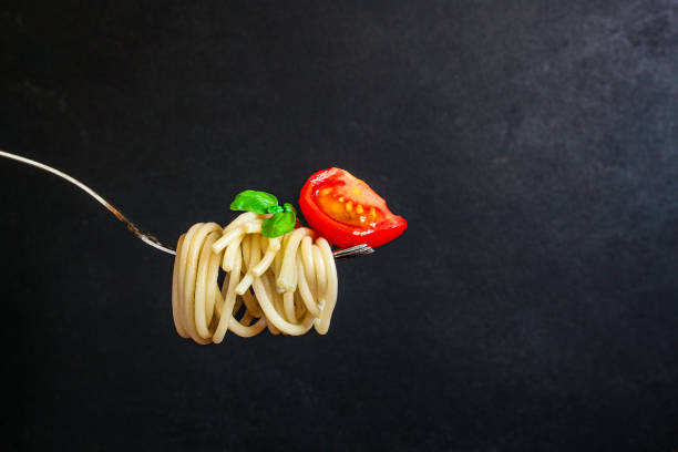 istock pasta spaghetti with tomato and basil, Menu concept healthy eating. food background top view copy space 1225653653