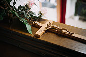photo of a cross on a wooden casket