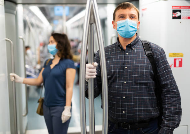 istock Passenger in medical mask riding in subway car 1225655861