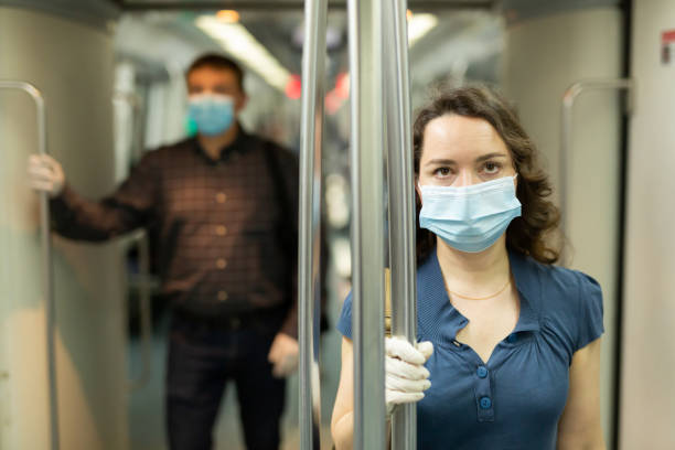 istock Travelers in protective equipment in a subway carriage 1225655932