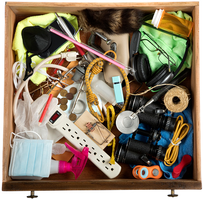 Junk Drawer with many miscellaneous objects.