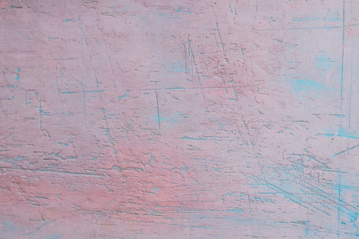 Pink and blue textured vintage wall background.