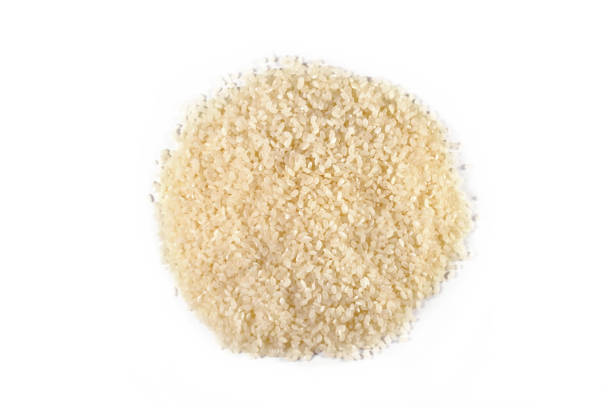 istock A pile of rice isolated on a white background. Top view. 1225659353