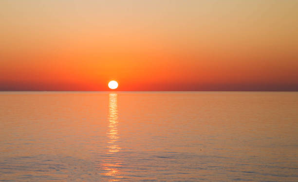 istock Sunset over sea with reflection in water 1225662627