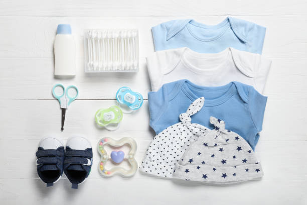 istock Flat lay composition with baby clothes and accessories on wooden background 1225664012