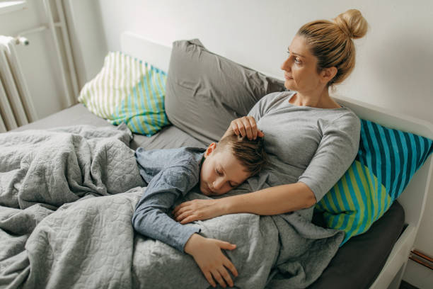 istock Mother and son in bedroom spend some quality time 1225664078