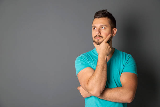 istock Young man in front of blackboard 1225664904