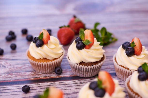 istock Cupcakes with strawberries and blueberries. Selective focus. 1225666000