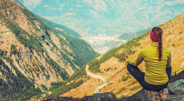 istock Female Maditating In Natural Mountain Environment. 1225668706