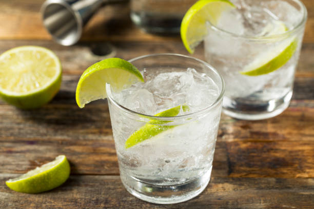 Refreshing Boozy Gin and Tonic Refreshing Boozy Gin and Tonic with Lime tonic water stock pictures, royalty-free photos & images