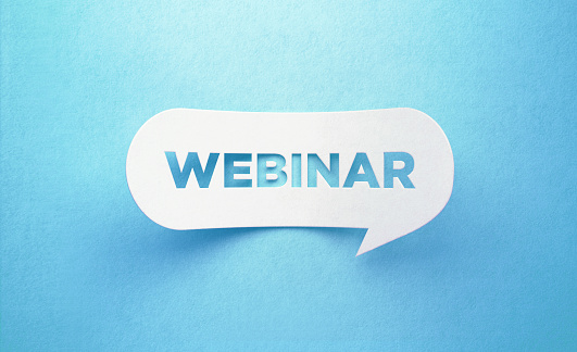 Webinar written white chat bubble on blue background. Horizontal composition with copy space. Webinar concept.
