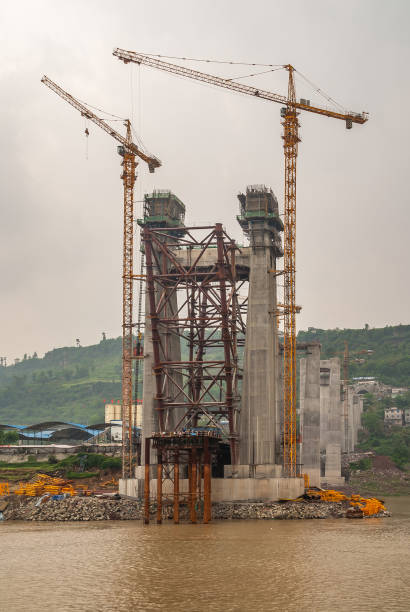 istock Frontal view on suspension pylon under construction along Yangtze River, China. 1225670819
