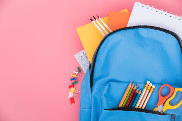 istock Blue bag backpack for education children on pink background back to school concept 1225674208